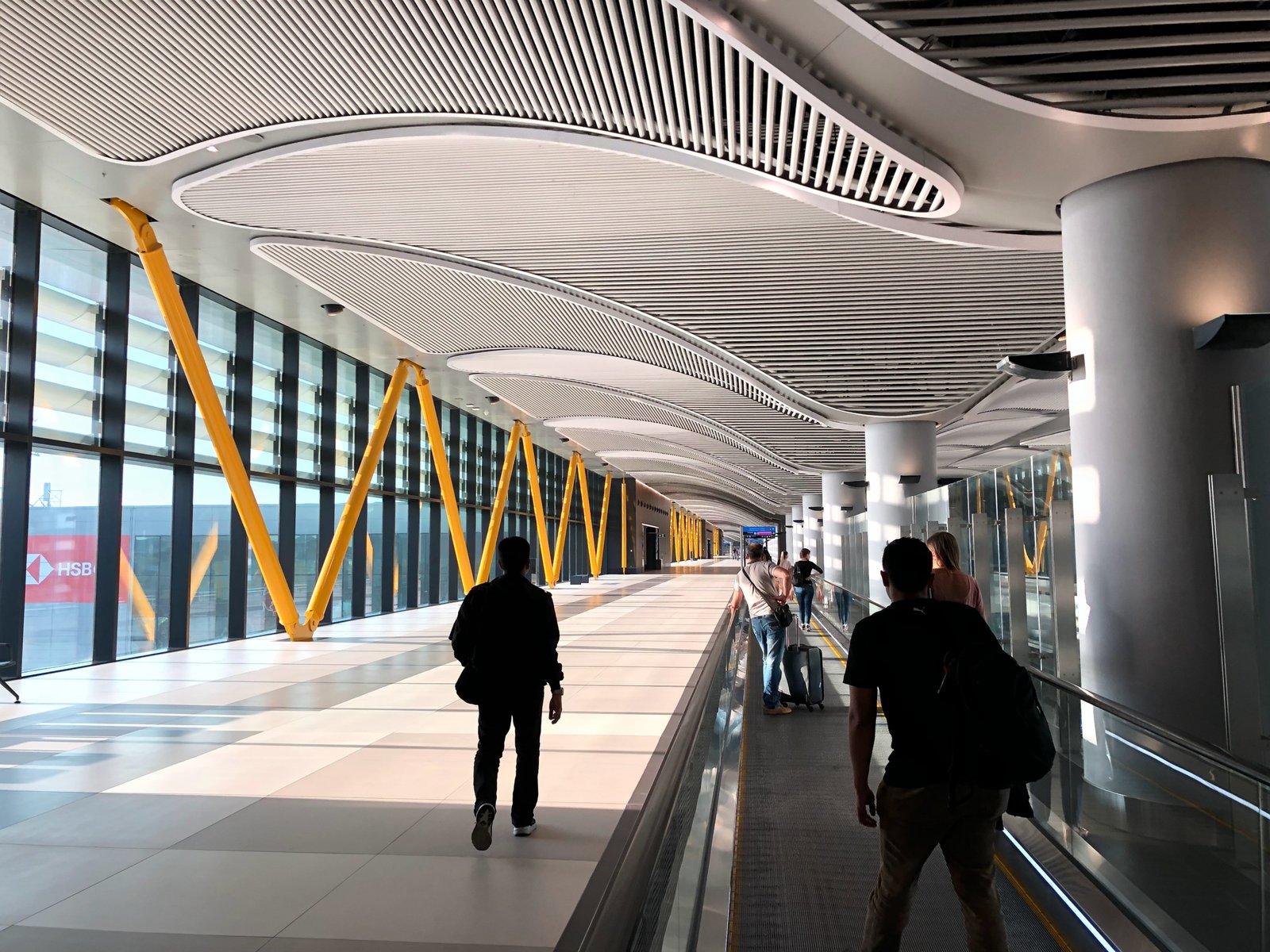 people walking on white tiled floor